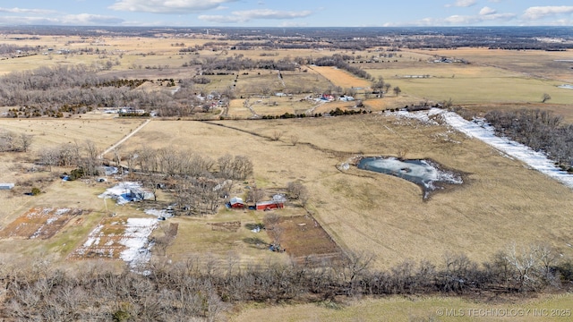 birds eye view of property featuring a rural view