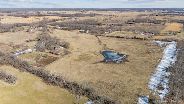 birds eye view of property with a rural view and a water view