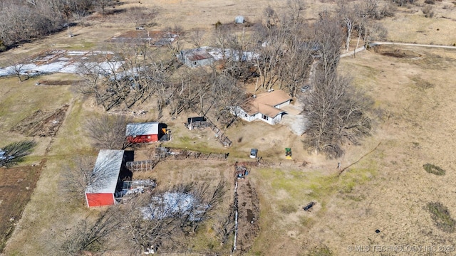 birds eye view of property with a rural view