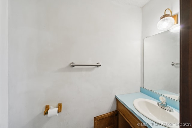 half bath featuring vanity