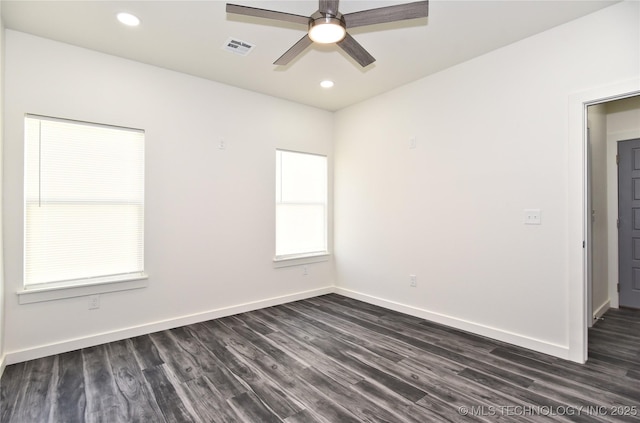 unfurnished room with ceiling fan and dark hardwood / wood-style floors