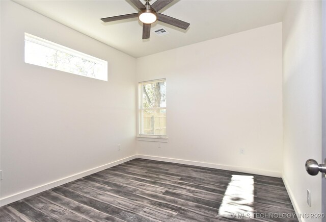 unfurnished room featuring ceiling fan and dark hardwood / wood-style floors