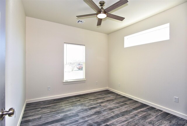 unfurnished room with ceiling fan, dark hardwood / wood-style flooring, and a wealth of natural light