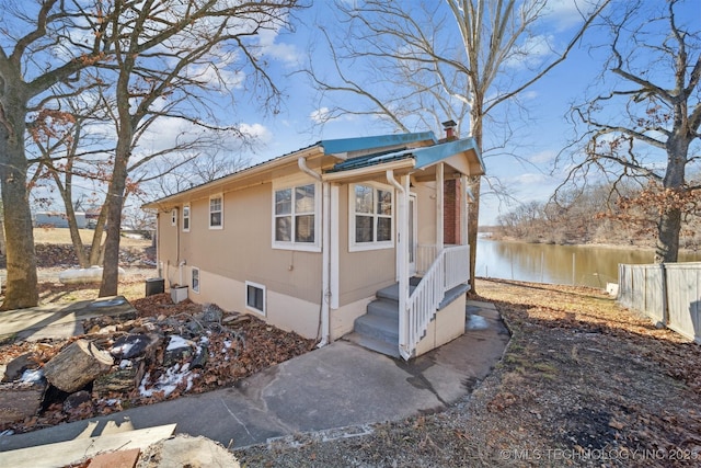 view of home's exterior featuring a water view