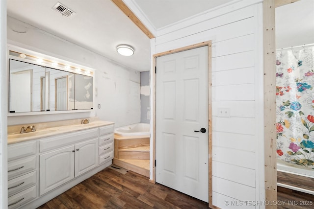 bathroom featuring wood-type flooring, vanity, independent shower and bath, and wooden walls