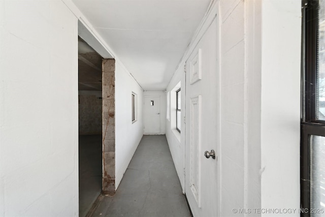 corridor with concrete floors