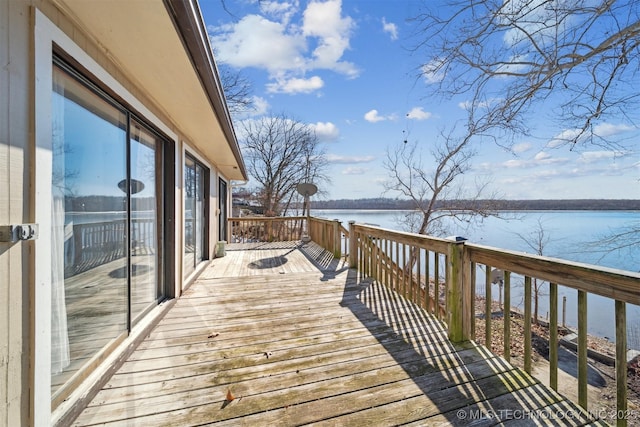 wooden deck featuring a water view