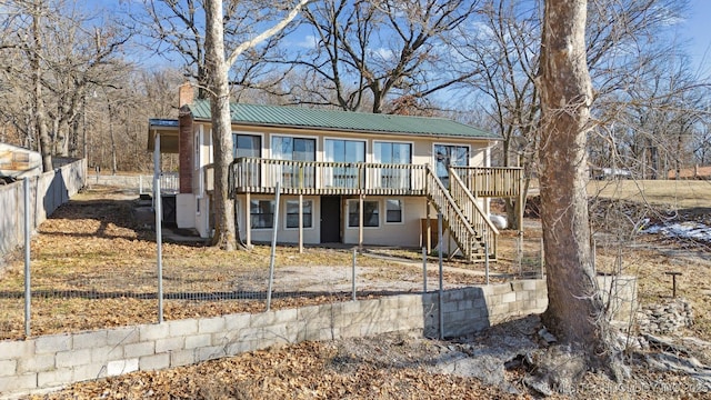 view of front of house with a wooden deck