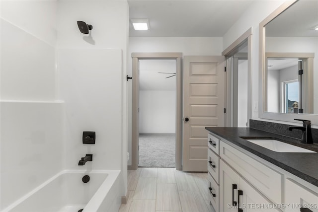 full bath featuring washtub / shower combination and vanity