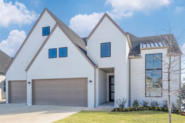 view of front of house with driveway, a garage, a front lawn, a shingled roof, and stucco siding