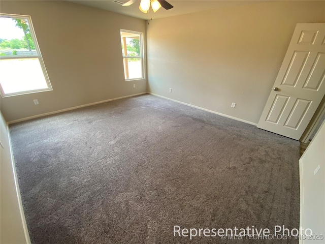 carpeted empty room with ceiling fan