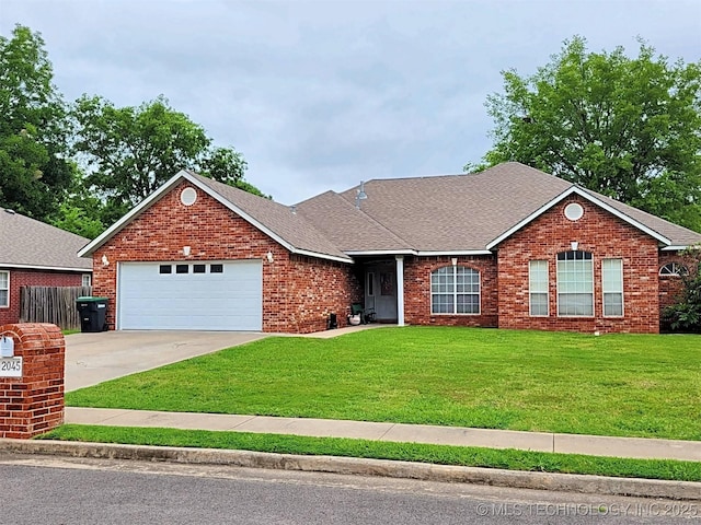 ranch-style home with a garage and a front yard