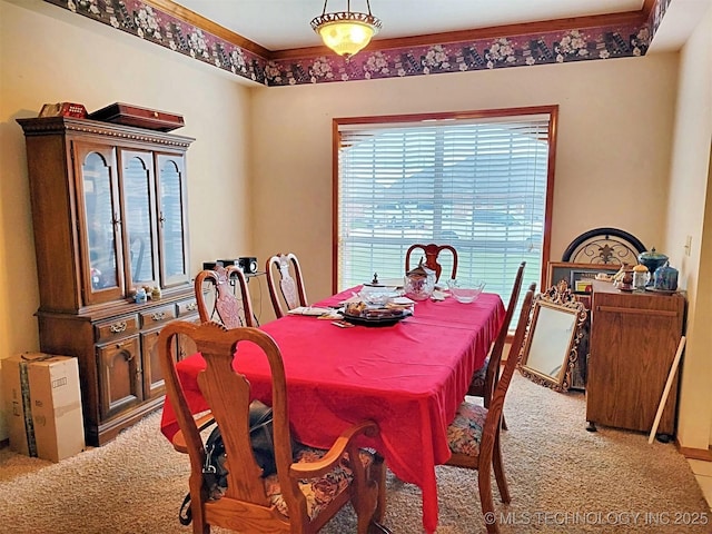 view of carpeted dining area