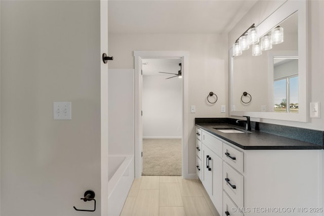 bathroom featuring vanity and a tub