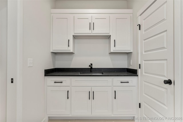 kitchen with sink and white cabinets