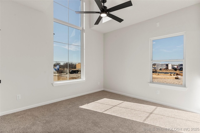 unfurnished room featuring ceiling fan, carpet floors, and a towering ceiling