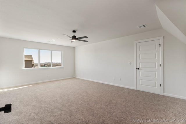 carpeted empty room featuring ceiling fan