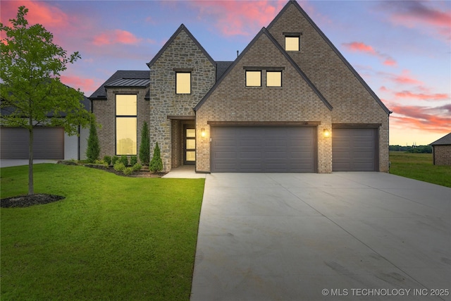 2501 E 134th Cir, Bixby, OK 74008 - view of front of property with driveway, a lawn, brick siding, and an attached garage