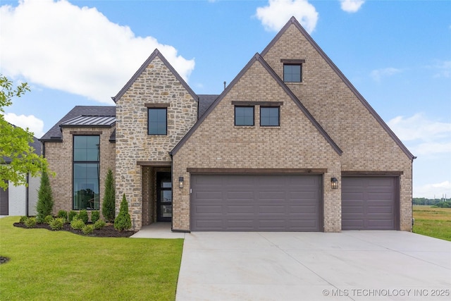 2501 E 134th Cir, Bixby, OK 74008 - view of front facade featuring concrete driveway, a front lawn, a standing seam roof, and an attached garage