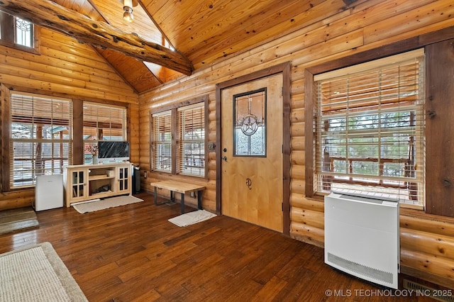 entrance foyer featuring hardwood / wood-style flooring, wooden ceiling, and rustic walls