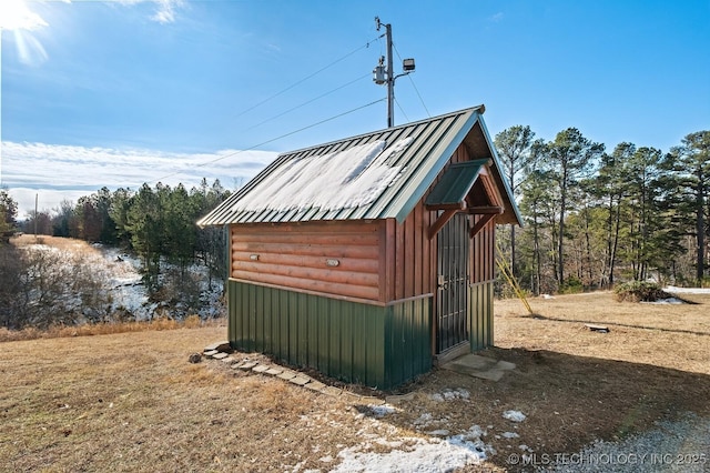 view of outbuilding featuring a yard