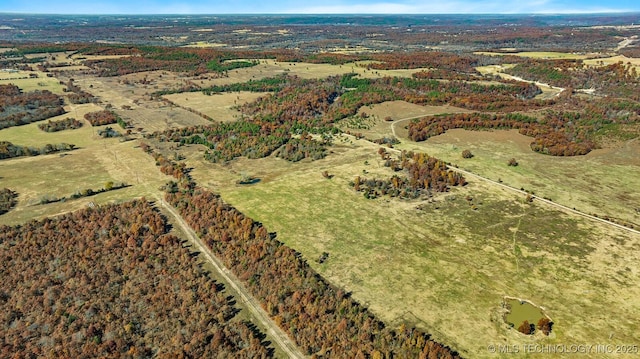 birds eye view of property with a rural view