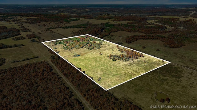 birds eye view of property featuring a rural view