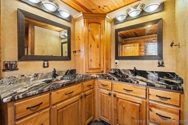 bathroom with wood ceiling and vanity