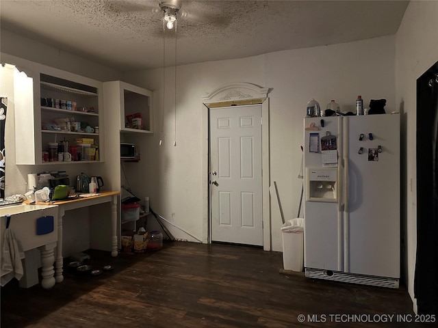 119 S Arkansas St, Caddo, OK 74729 - kitchen with white fridge with ice dispenser, dark wood finished floors, a ceiling fan, and a textured ceiling