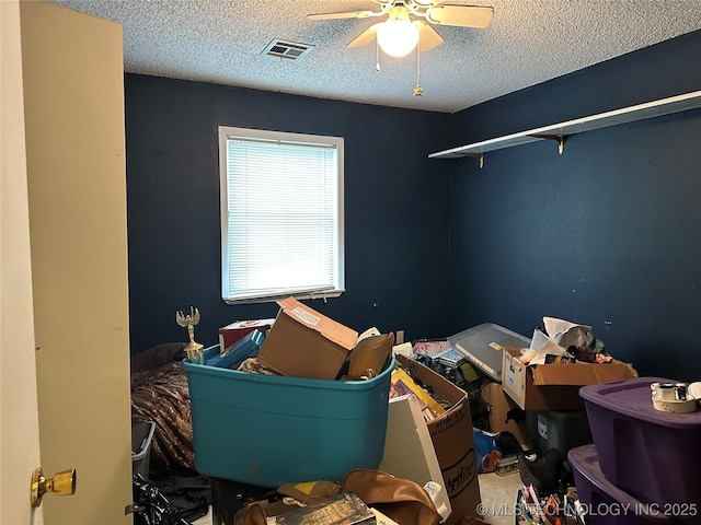 119 S Arkansas St, Caddo, OK 74729 - bedroom with a textured ceiling, a ceiling fan, and visible vents