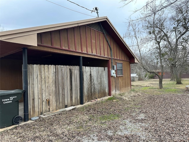 119 S Arkansas St, Caddo, OK 74729 - view of home's exterior featuring an outbuilding