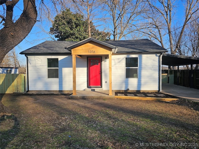 view of front facade with a carport