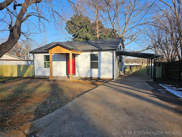 view of front facade with a carport