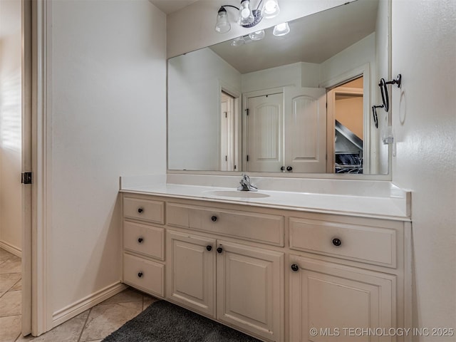 bathroom with tile patterned floors and vanity