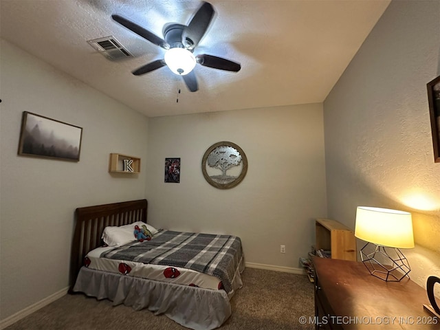 bedroom featuring a textured ceiling, ceiling fan, and carpet floors