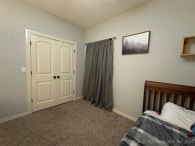 carpeted bedroom with a closet