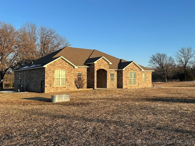 ranch-style house with central AC unit