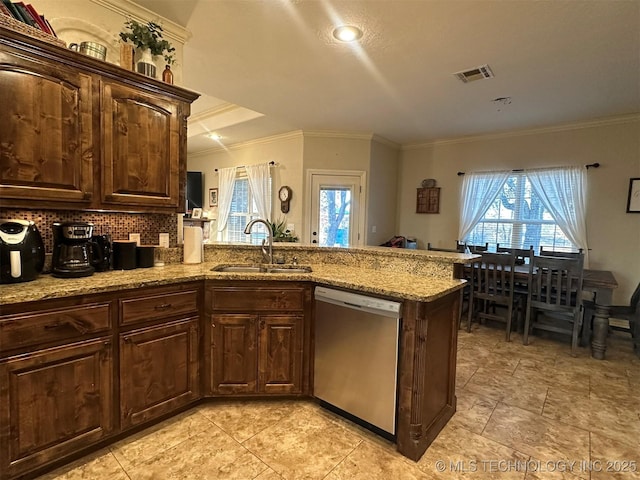 kitchen with decorative backsplash, sink, stainless steel dishwasher, and crown molding