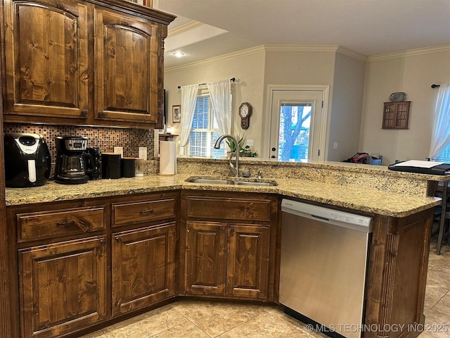 kitchen with decorative backsplash, stainless steel dishwasher, light stone counters, dark brown cabinetry, and sink