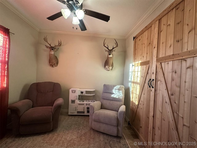 living area with ceiling fan and crown molding