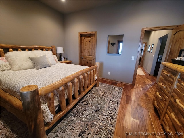 bedroom featuring wood-type flooring