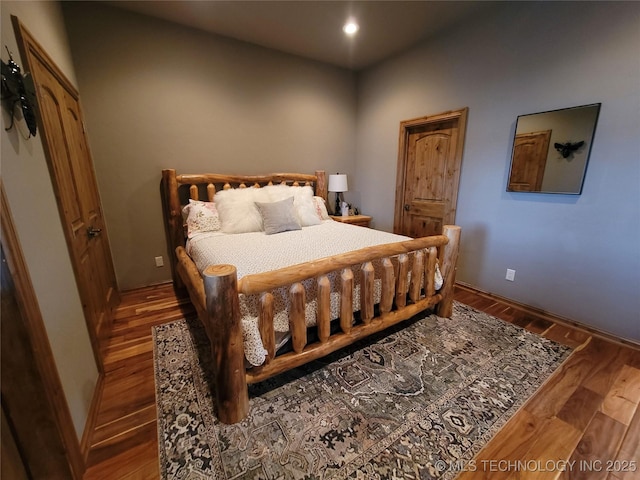 bedroom featuring hardwood / wood-style floors