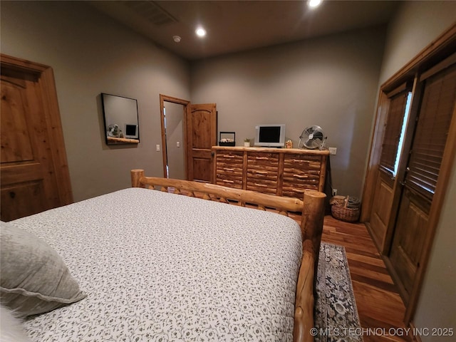 bedroom featuring hardwood / wood-style floors