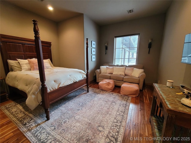 bedroom featuring dark hardwood / wood-style floors