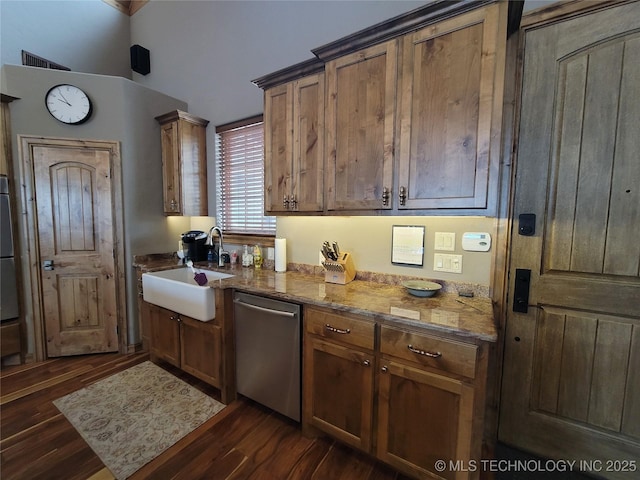 kitchen with sink, stone counters, dishwasher, and dark hardwood / wood-style flooring