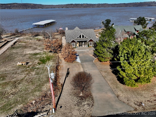 drone / aerial view with a water view