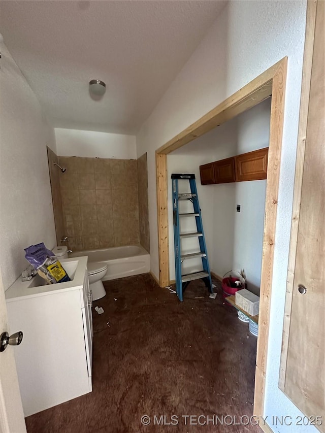 full bathroom featuring toilet, bathtub / shower combination, vanity, and concrete floors