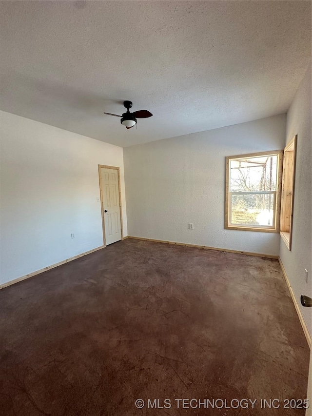 carpeted empty room featuring a textured ceiling and ceiling fan