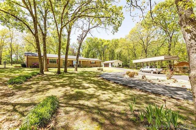 view of yard featuring a carport