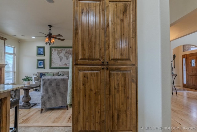 interior space featuring ceiling fan and light hardwood / wood-style flooring